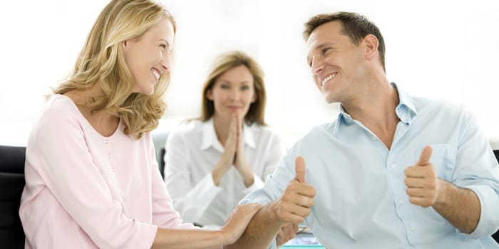 Couple dealing with a financial adviser at the credit union